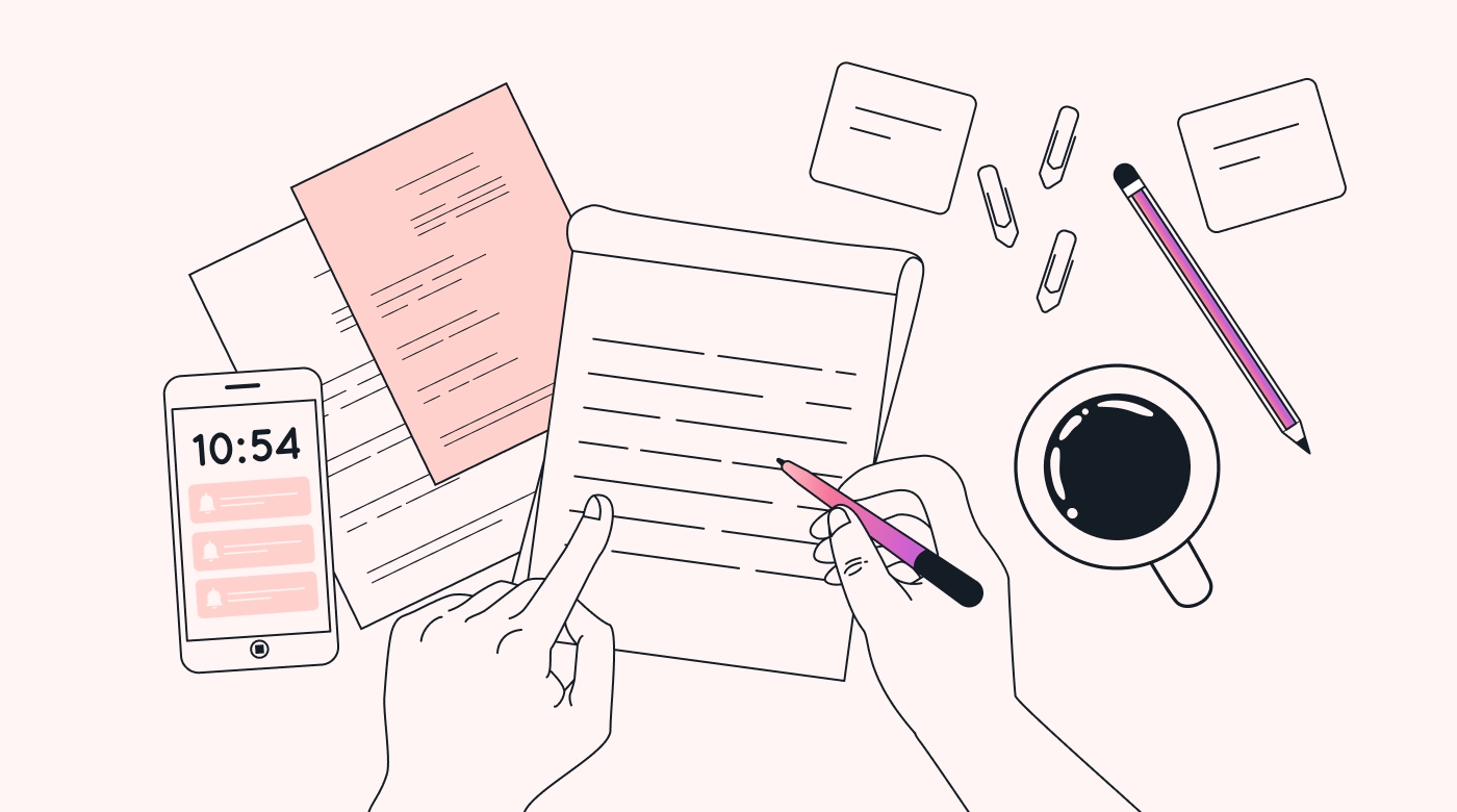 A desk covered in paper lists, a phone with notifications, and coffee.