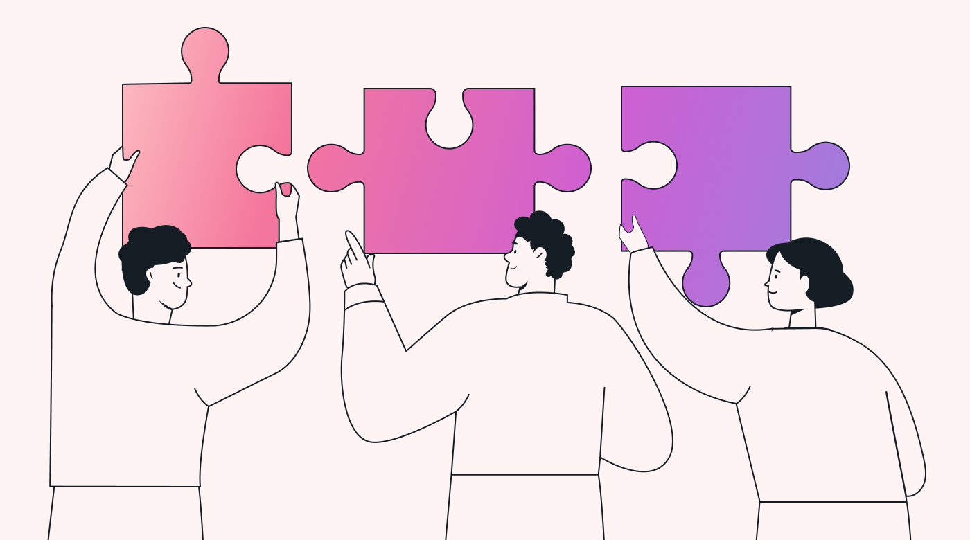 Three people holding up jigsaw pieces that fit together
